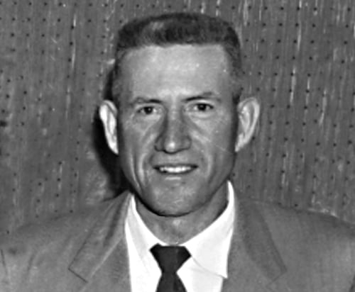 Businessman Joe Cox wearing a suit and tie